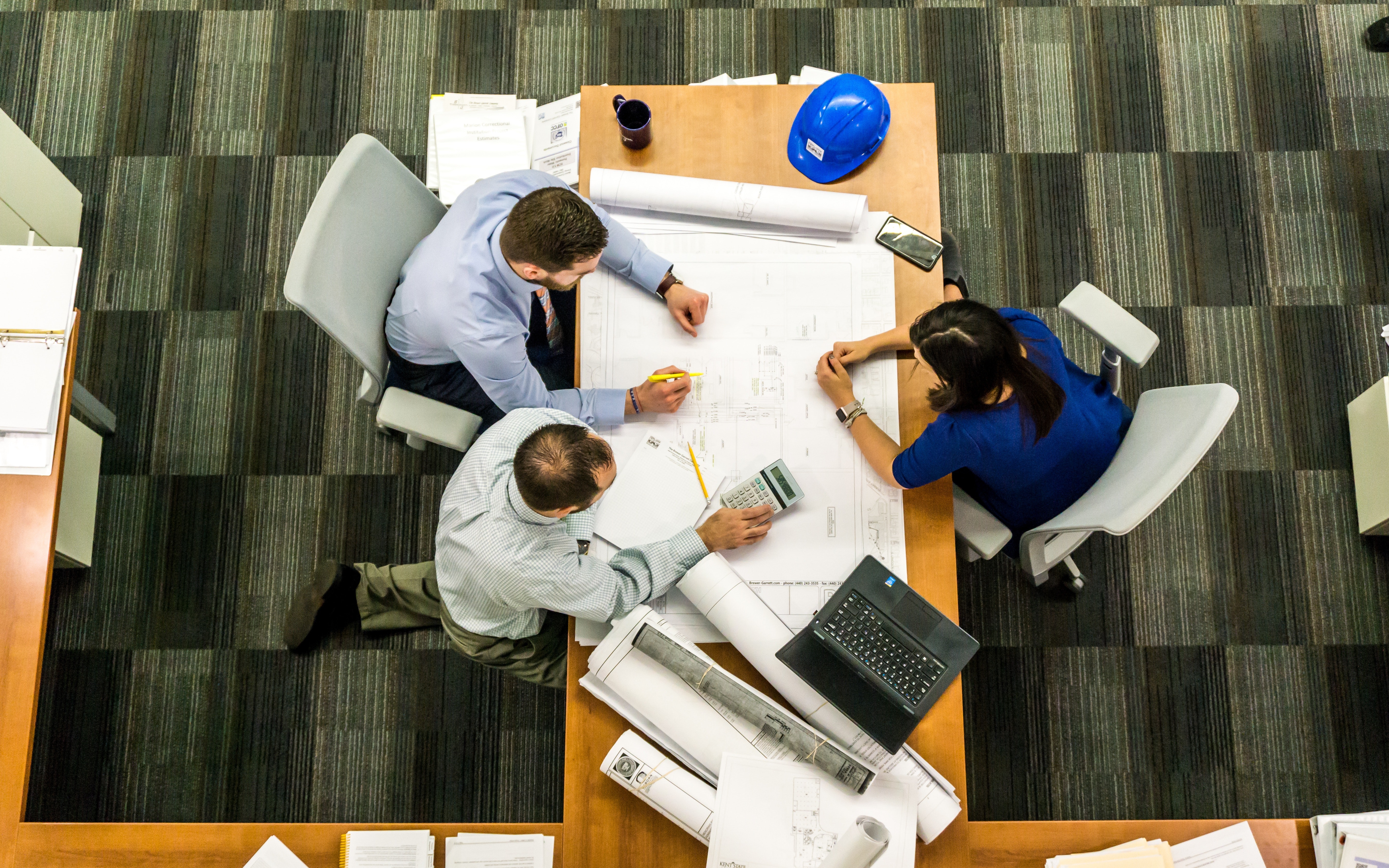 Workers meeting round a table