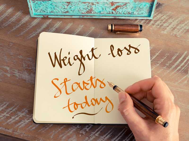 Weight loss starts here written in a diary