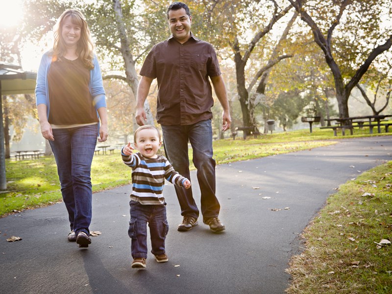 Couple walking with child
