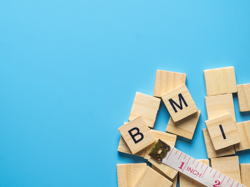 Letters BMI written on small wooden squares