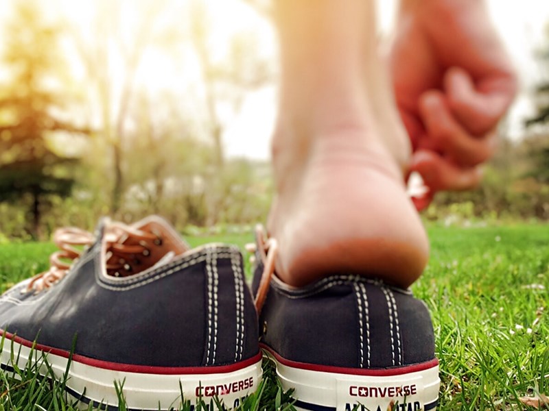 Someone putting on shoes